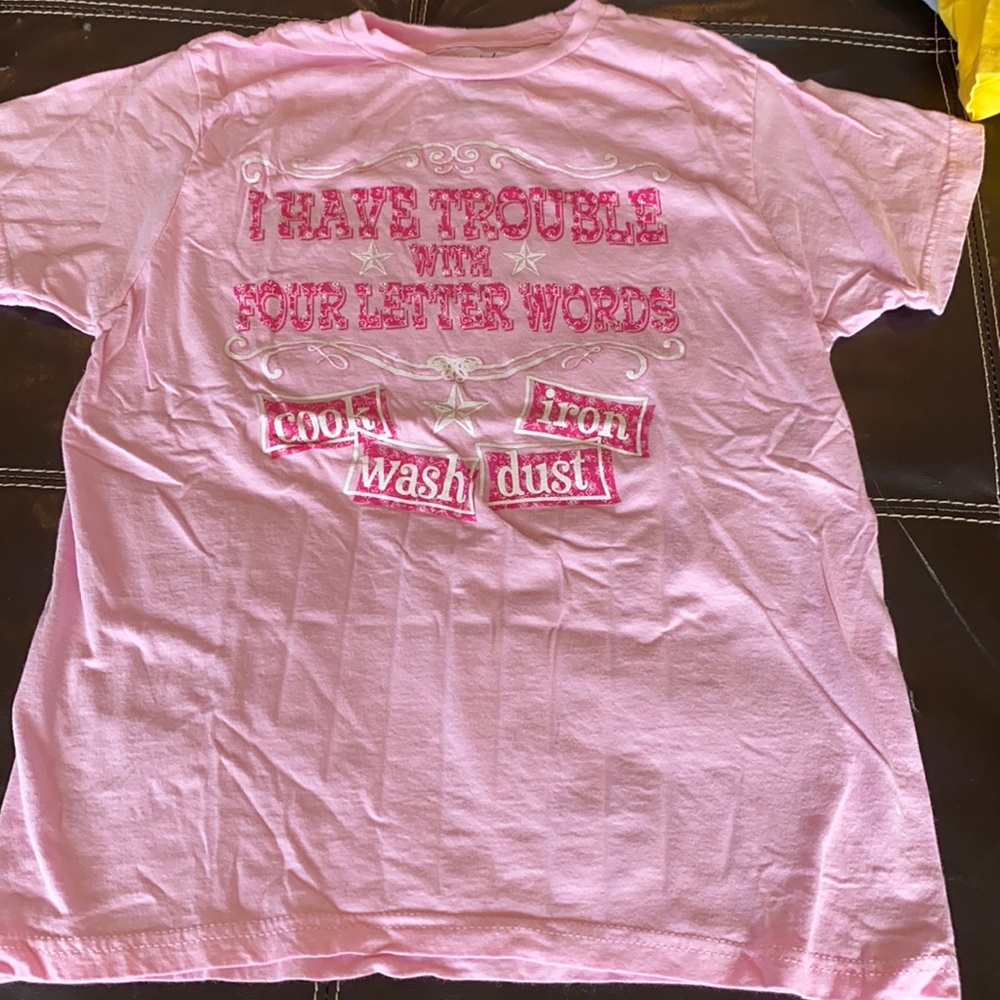 Pink women’s shirt that says “I have trouble with four letter words” size Med